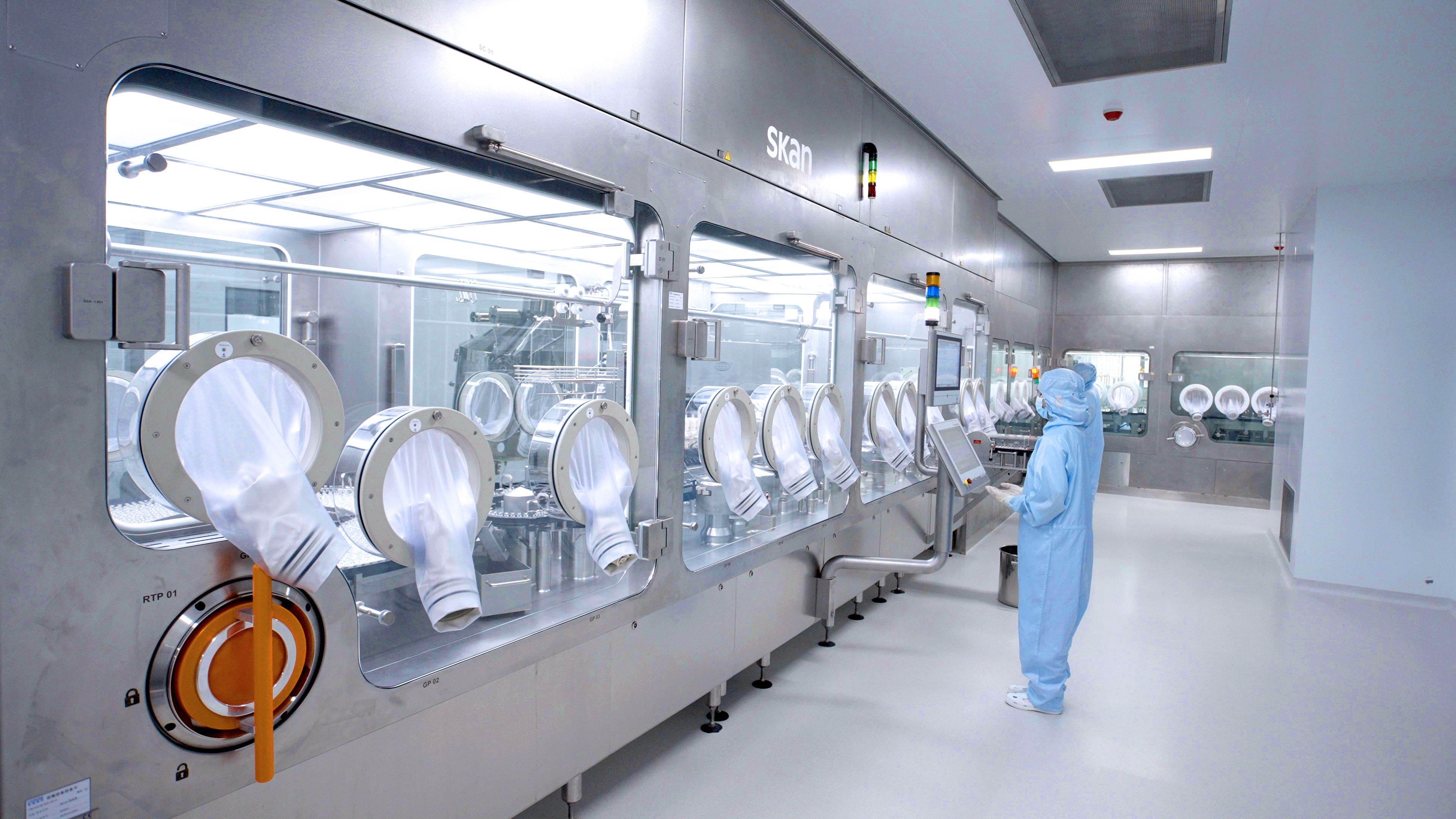 Masked operators at Apichope lyophilized injection production equipment
